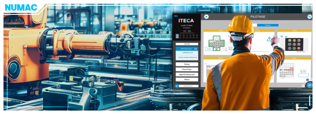 Le nom du projet est NUMAC et l'image montre un contremaître utilisant un diaporama de Qualité-Sécurité-Environnement sur un écran tactile géant dans une usine